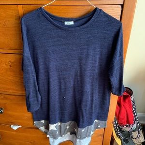 Blue knit sweater with stars on bottom accent